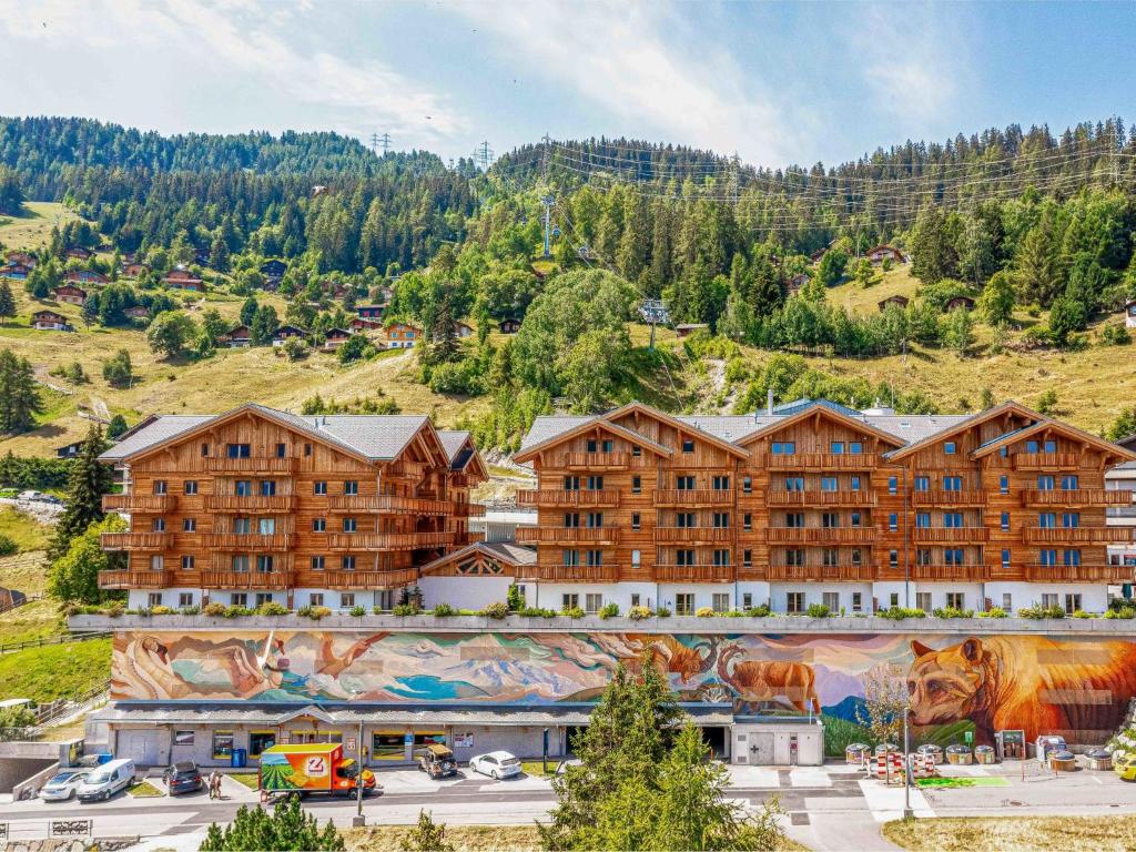 an aerial view of a resort with a mural at Apartment T-Resort La Tzoumaz 4p8 vue vallée by Interhome in La Tzoumaz