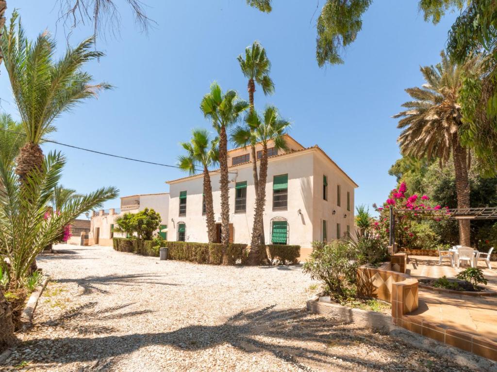 a house on the beach with palm trees at Holiday Home Virgen de las Angustias by Interhome in Playas de Vera