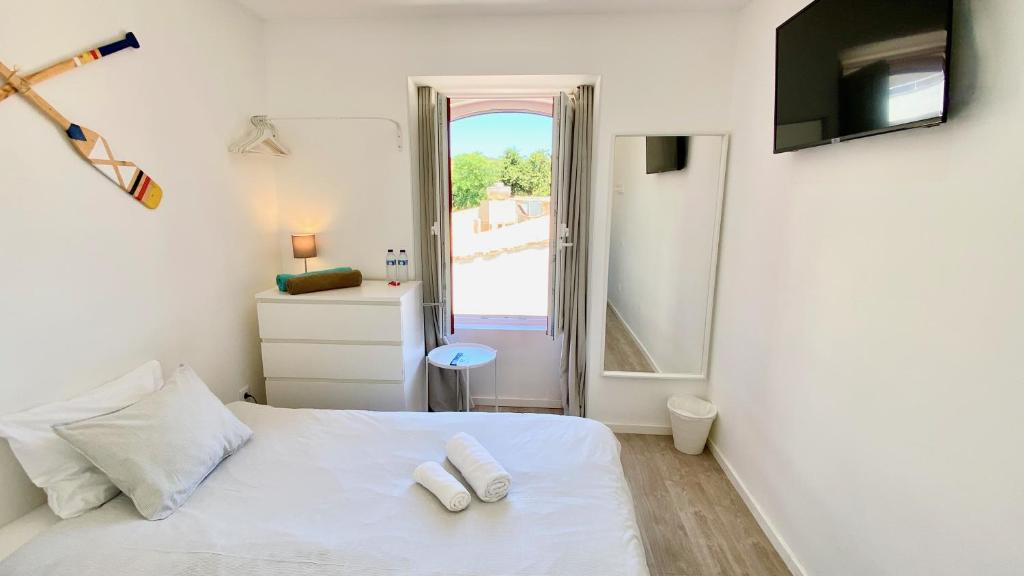 Postel nebo postele na pokoji v ubytování Casa Amarela Guesthouse