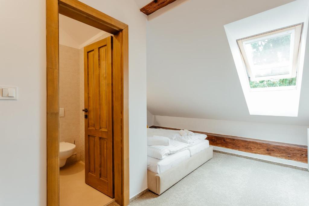 A bed or beds in a room at Boutique Hotel Siglisberg
