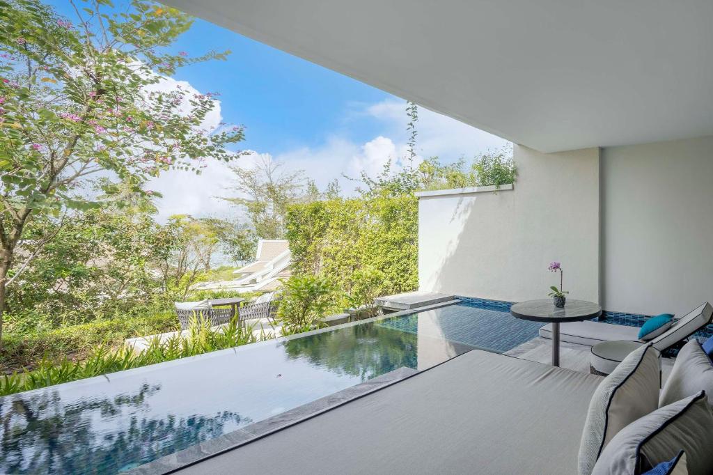 an infinity pool in a house with a view at Banyan Tree Krabi in Tab Kaek Beach