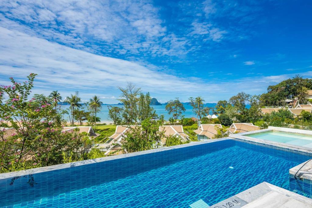 a swimming pool in a villa with a view of the ocean at Banyan Tree Krabi in Tab Kaek Beach