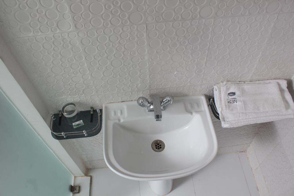 Koupelna v ubytování Hotel Nest International