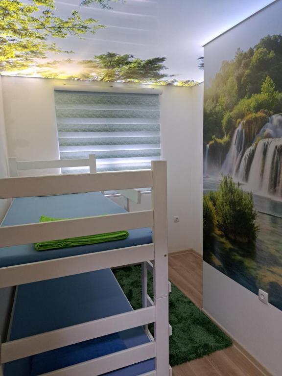 Postel nebo postele na pokoji v ubytování Stan na danS Šid