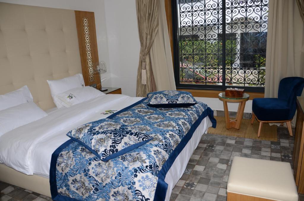Postel nebo postele na pokoji v ubytování Aralia Boutique Hôtel