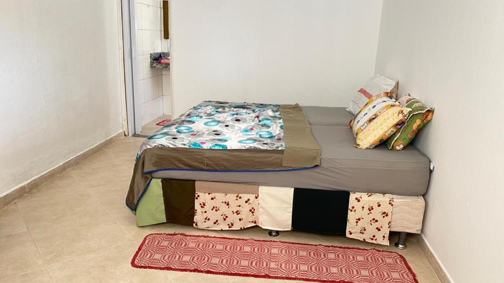 Katil atau katil-katil dalam bilik di Casa de Praia do Marcinho