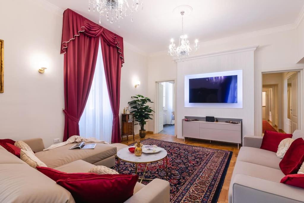 a living room with two couches and a tv at Domus Quirinale in Rome