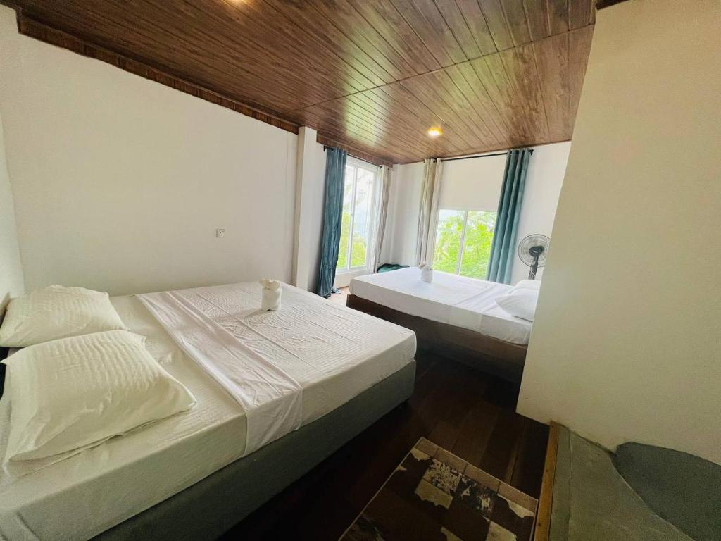 Postel nebo postele na pokoji v ubytování Dolape Villa