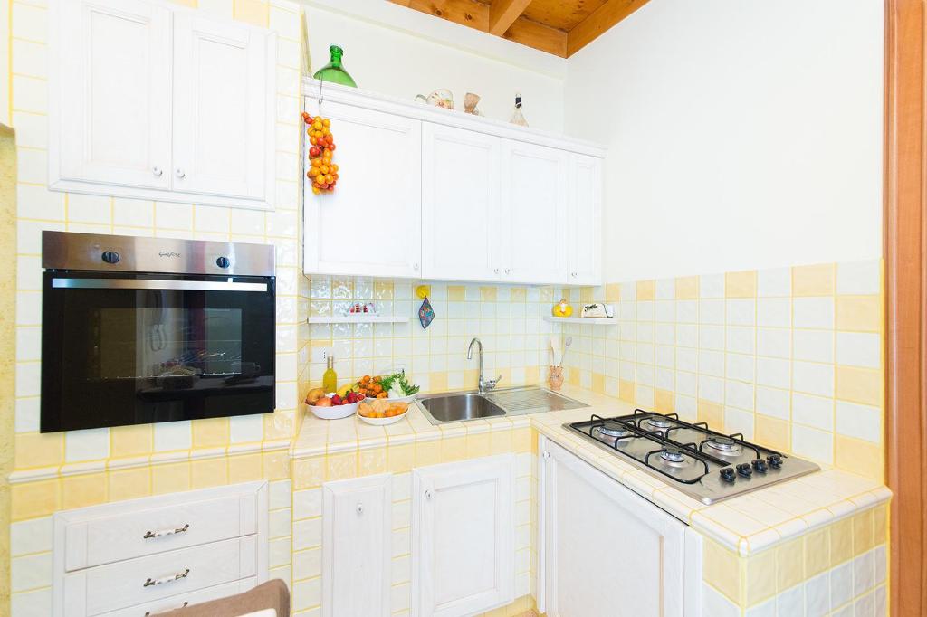 Kuchyň nebo kuchyňský kout v ubytování Casa Lucia