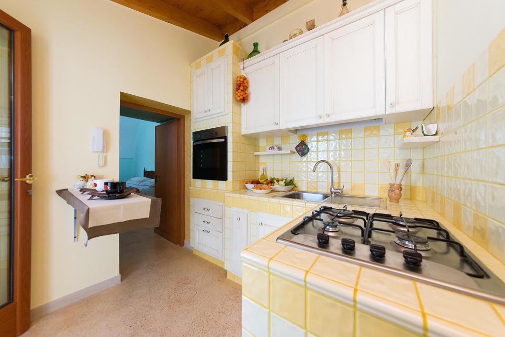 Kuchyň nebo kuchyňský kout v ubytování Casa Lucia