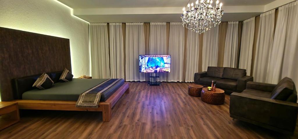 Televiisor ja/või meelelahutuskeskus majutusasutuses Privat-Spa mit Whirlpool und Sauna in Sursee