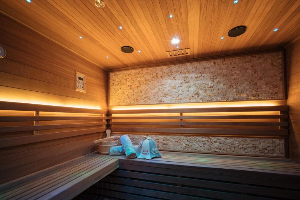a sauna with two towels and two shoes in it at Privat-Spa mit Whirlpool und Sauna in Sursee in Sursee