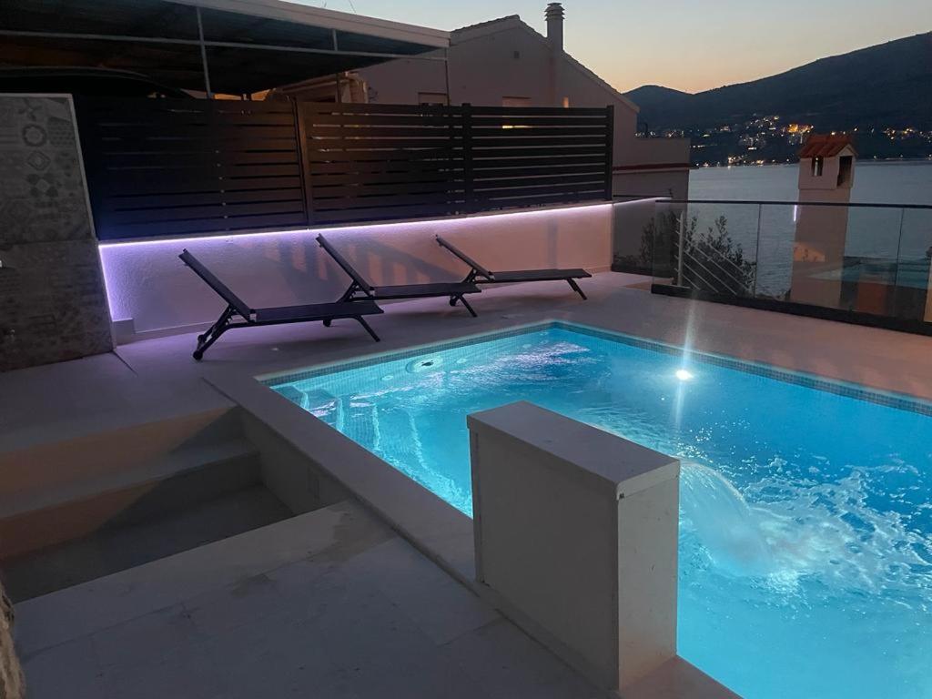 a swimming pool on the roof of a building at Lavanda Residence with Heated Pool Trogir Split in Okrug Donji