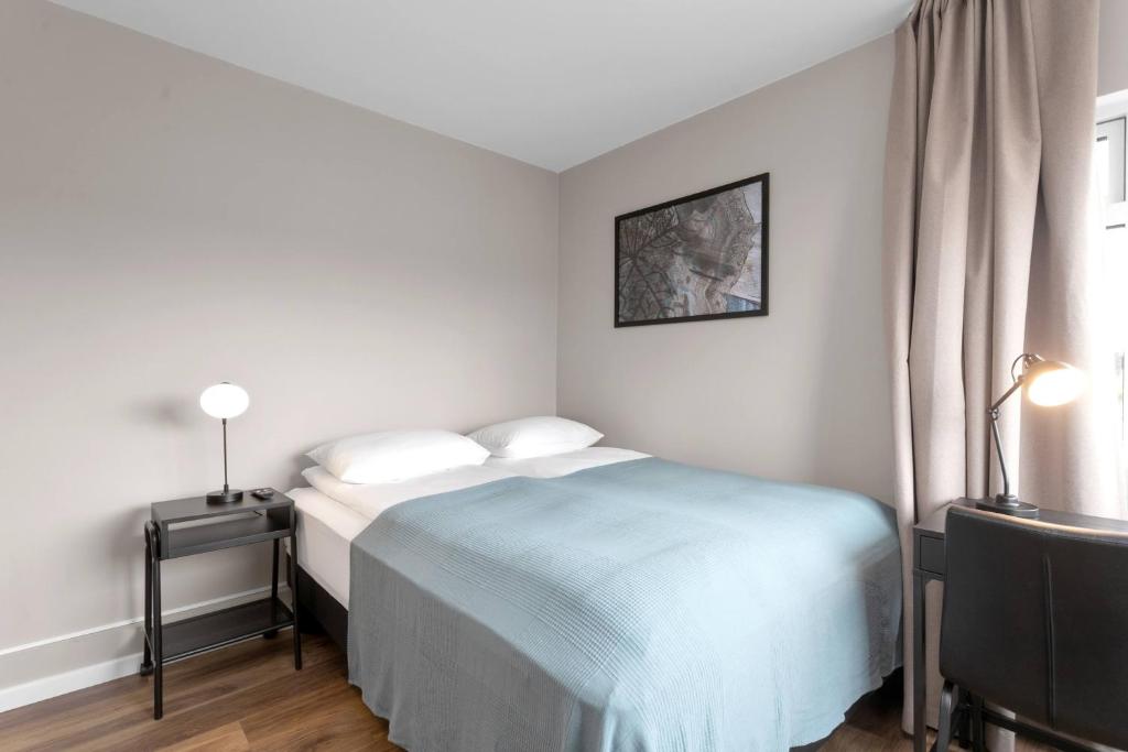 Postel nebo postele na pokoji v ubytování Reykjavík Central Guesthouse