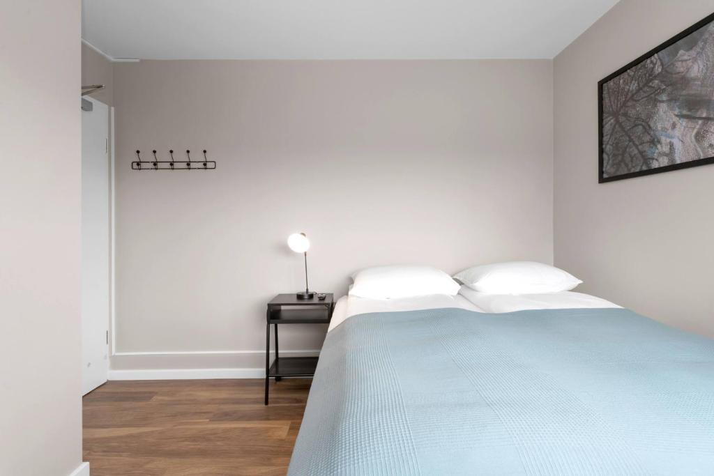 Postel nebo postele na pokoji v ubytování Reykjavík Central Guesthouse