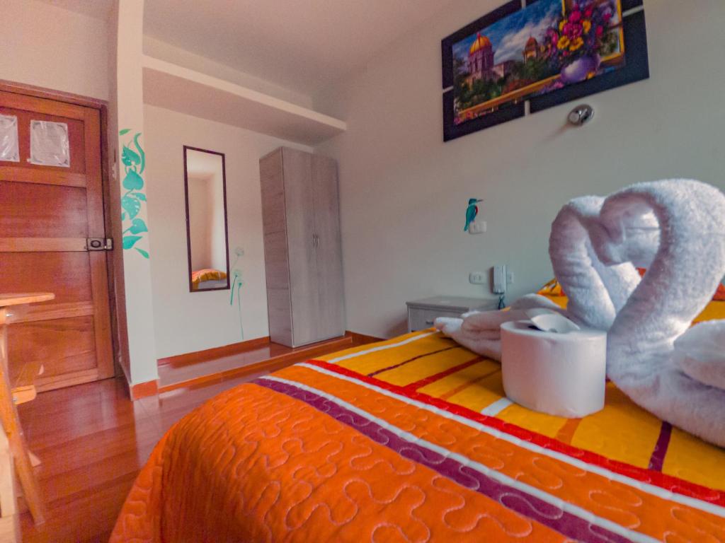 Postel nebo postele na pokoji v ubytování Residencial Marina House