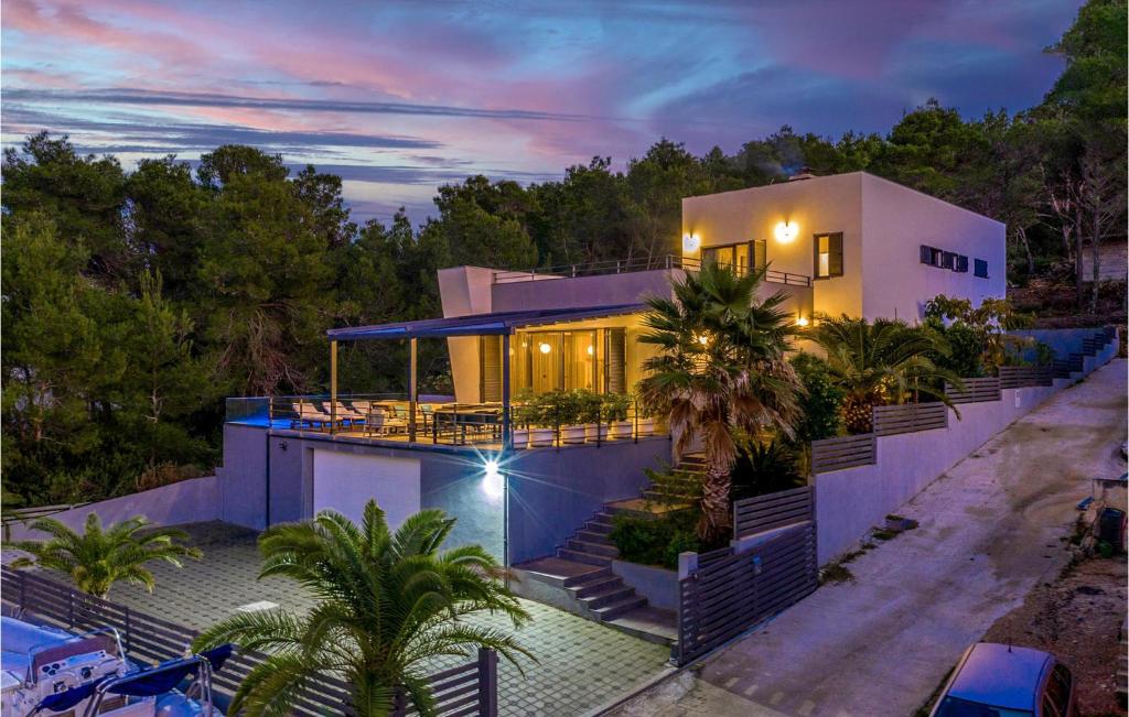 a house with a pool in front of it at Villa Bella in Mrljane