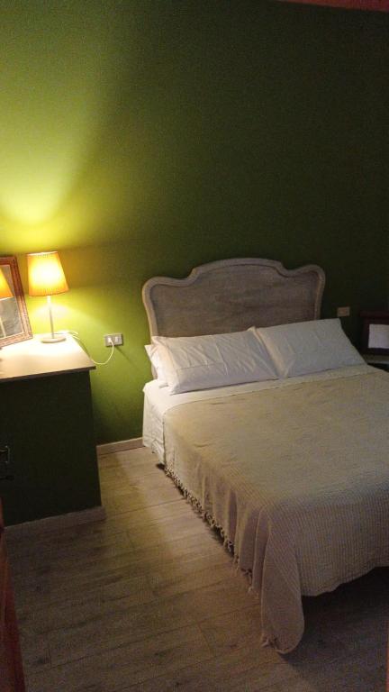 Postel nebo postele na pokoji v ubytování Il Conte di Montechiaro Rural B&B