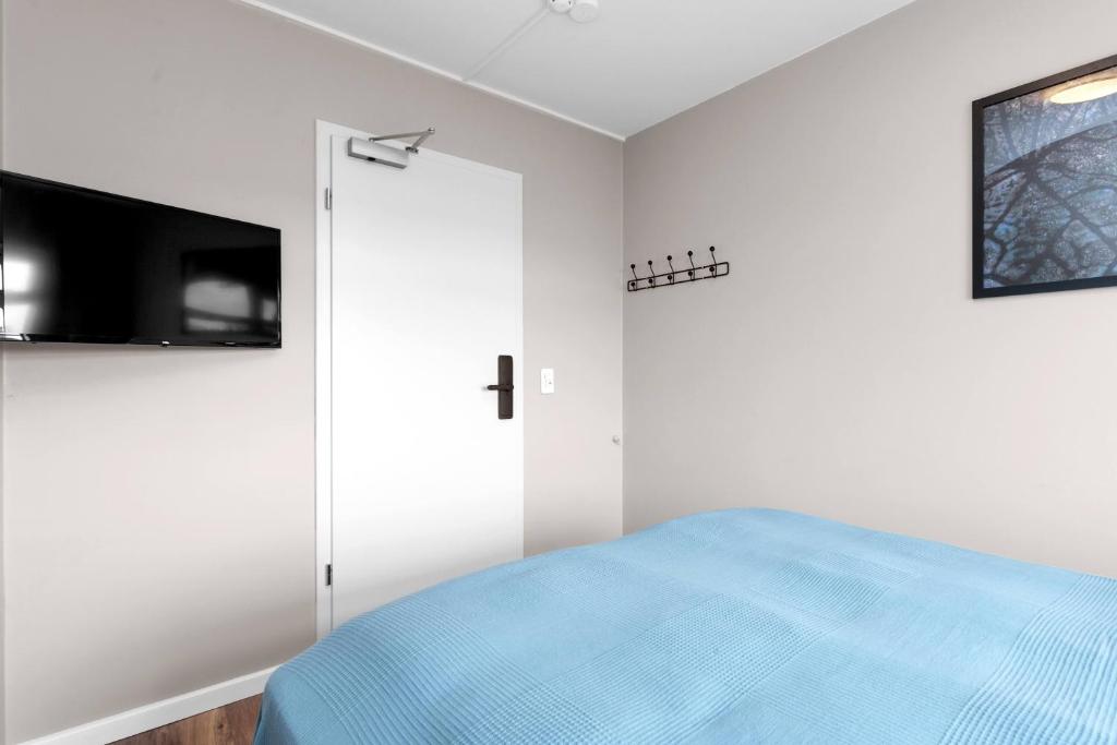 Postel nebo postele na pokoji v ubytování Reykjavík Central Guesthouse