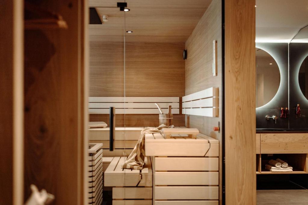 A bed or beds in a room at Alpina Alpendorf