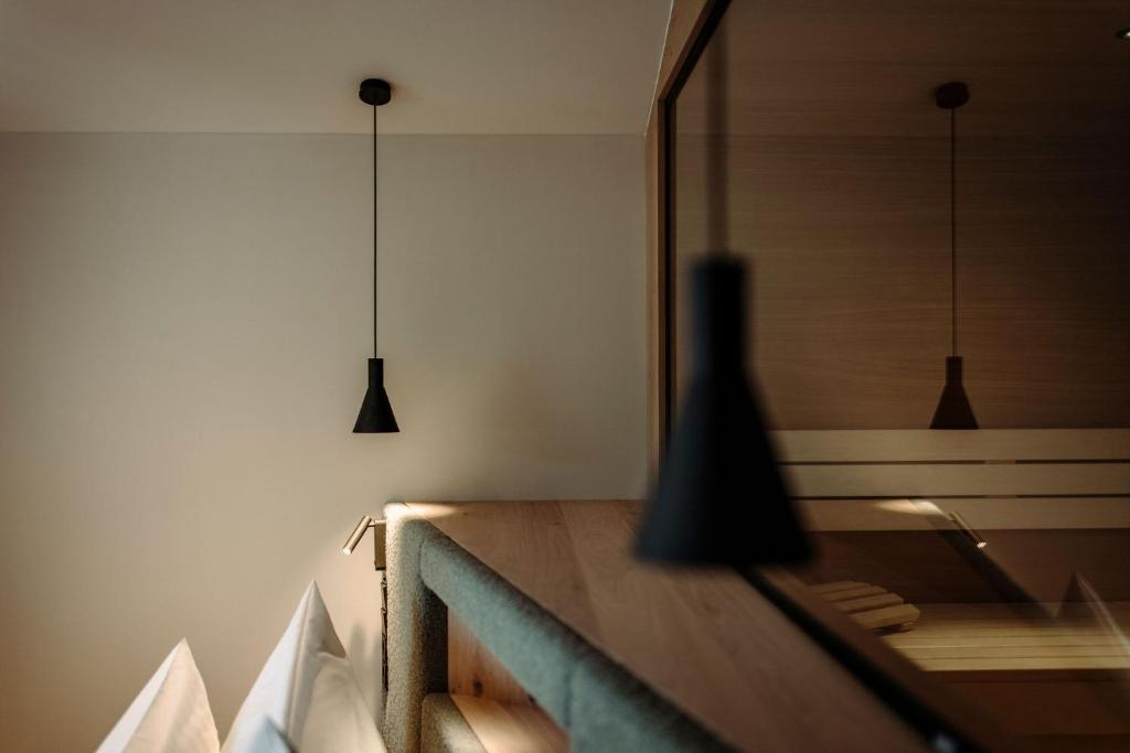 A bed or beds in a room at Alpina Alpendorf