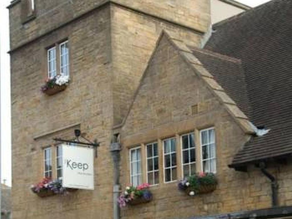 a building with a keep sign on the side of it at The Keep Boutique Hotel in Yeovil