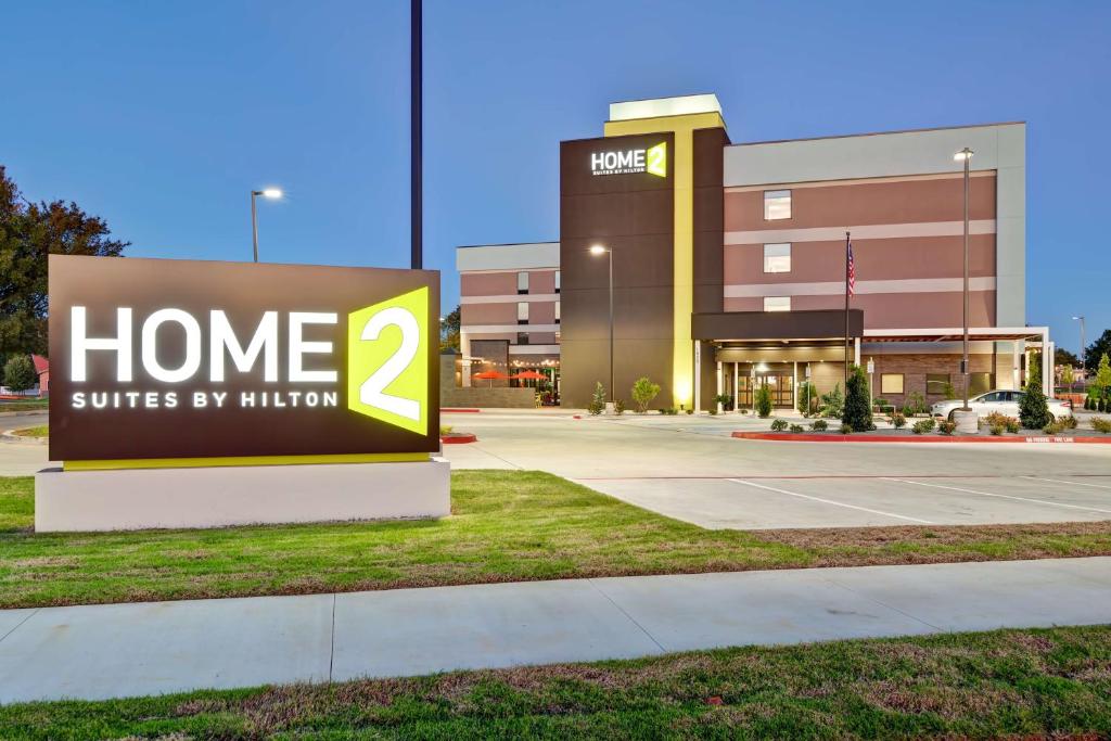 a sign that reads home suites by mission at Home2 Suites by Hilton OKC Midwest City Tinker AFB in Midwest City