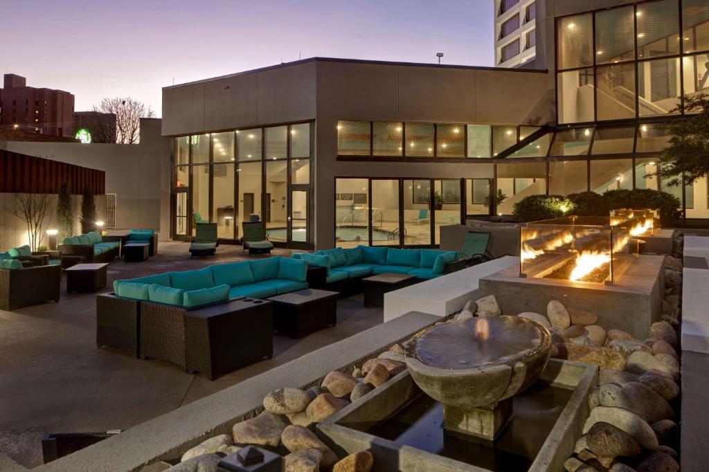 a building with a fire pit in front of it at Embassy Suites By Hilton Oklahoma City Northwest in Oklahoma City