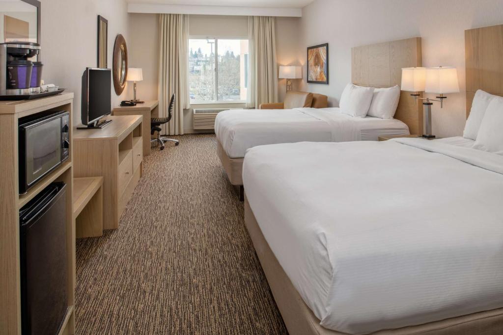 Postel nebo postele na pokoji v ubytování DoubleTree by Hilton Olympia
