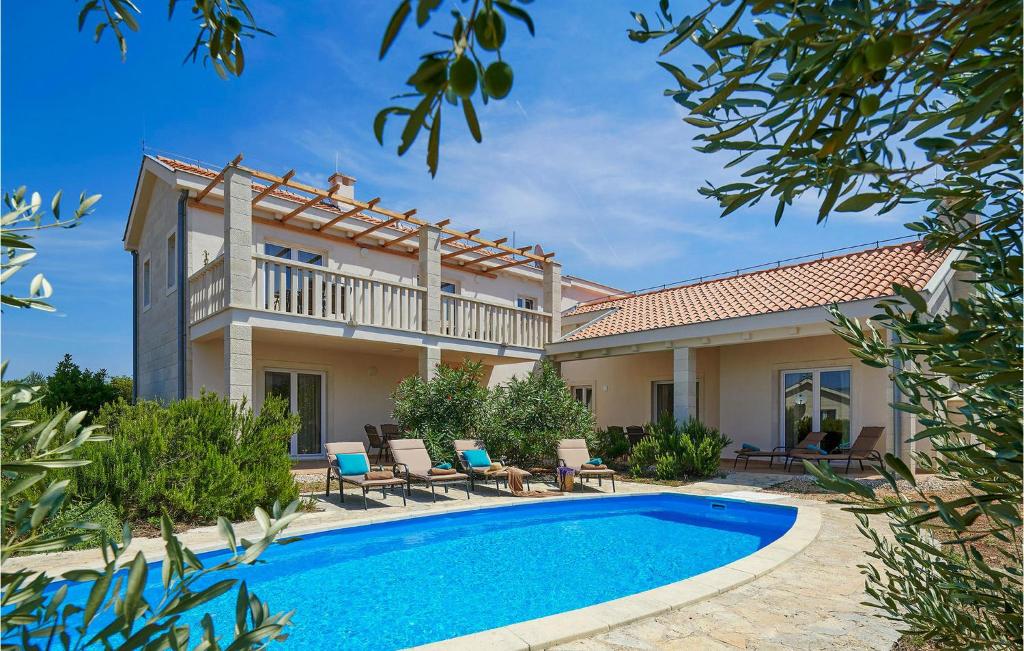 a villa with a swimming pool and a house at Villa 1 Mala Rudina in Rudina