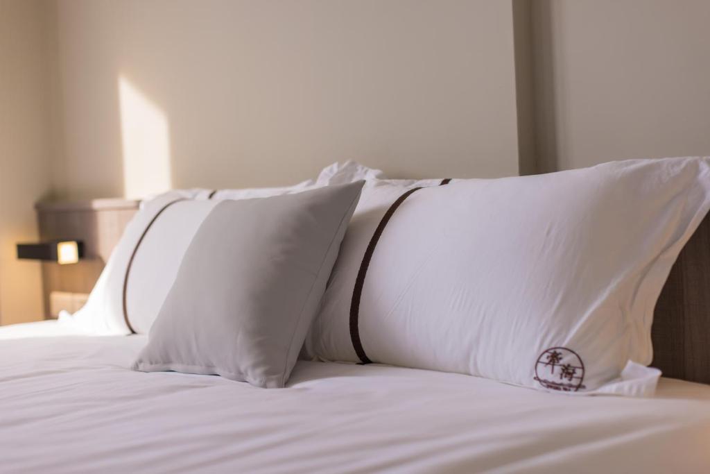 Postel nebo postele na pokoji v ubytování Penghu Swing Sea Homestay