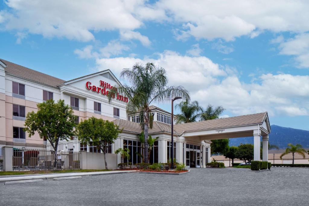 a hotel with a palm tree in front of it at Hilton Garden Inn Arcadia/Pasadena Area in Arcadia