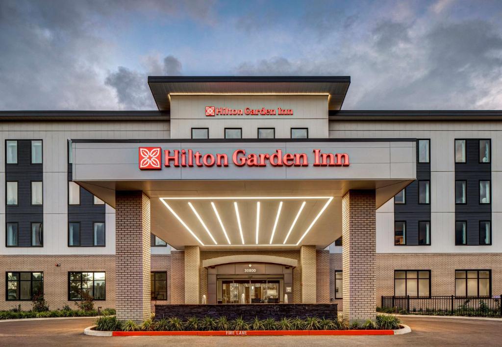 a building with a million garden inn sign on it at Hilton Garden Inn Wilsonville Portland in Wilsonville