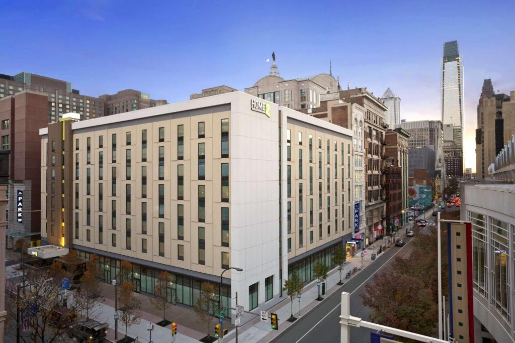 a large white building on a street in a city at Home2 Suites by Hilton Philadelphia Convention Center in Philadelphia
