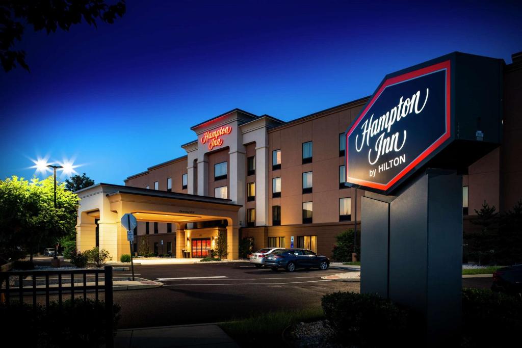 a hotel sign in front of a building at Hampton Inn Limerick in Limerick