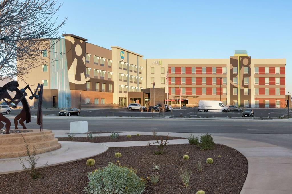 a city street with a statue in front of a building at Home2 Suites By Hilton Scottsdale Salt River in Scottsdale