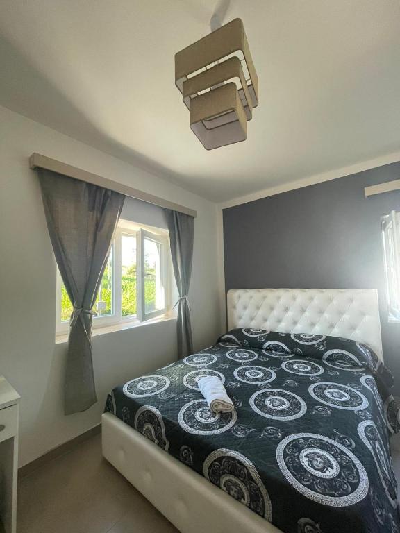 Postel nebo postele na pokoji v ubytování Villa Aurea