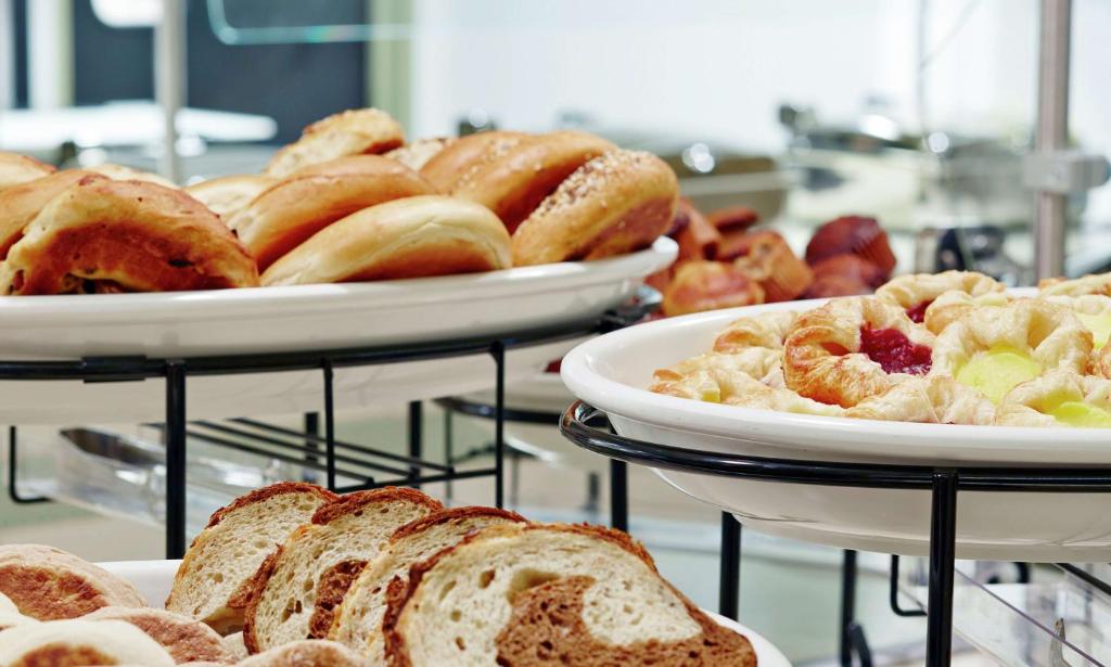 a bunch of different types of bread and pastries at Hilton Garden Inn Phoenix Downtown in Phoenix