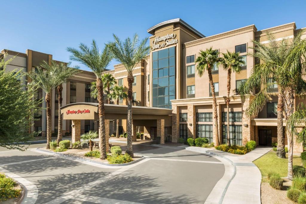a rendering of the front of the hotel with palm trees at Hampton Inn & Suites Phoenix Glendale-Westgate in Glendale
