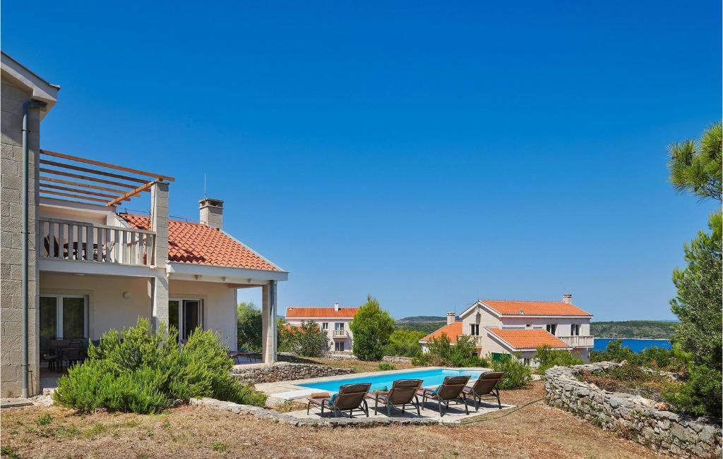 a villa with a swimming pool and a house at Villa 6 Mala Rudina in Rudina