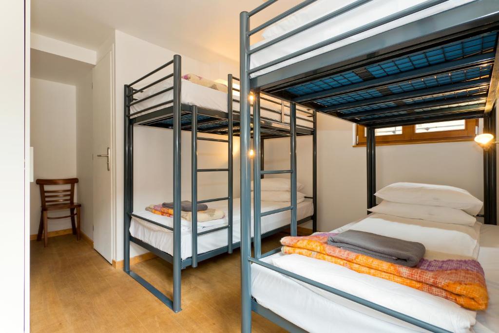 Postel nebo postele na pokoji v ubytování Hideout Hostel