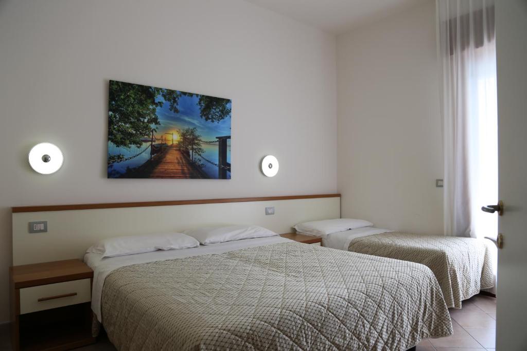 Кровать или кровати в номере Villaggio Mare Blu