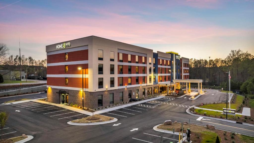 a rendering of a hotel in a parking lot at Home2 Suites By Hilton Raleigh State Arena in Raleigh