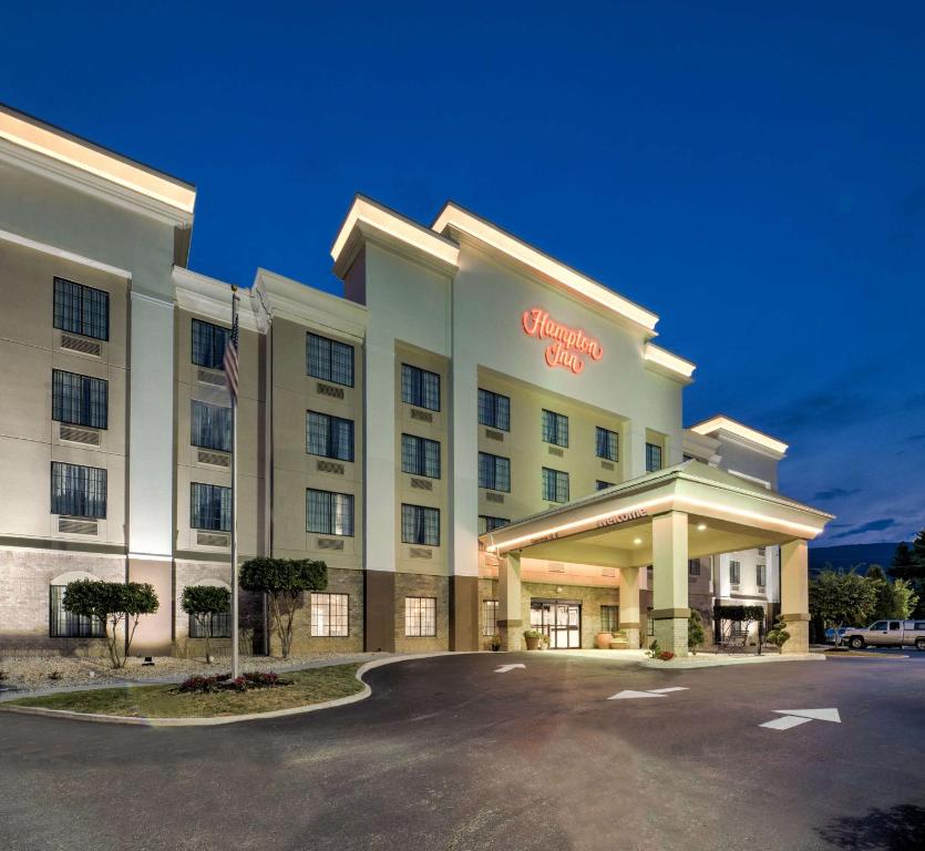 a hotel with a sign on the front of it at Hampton Inn Salem in Salem