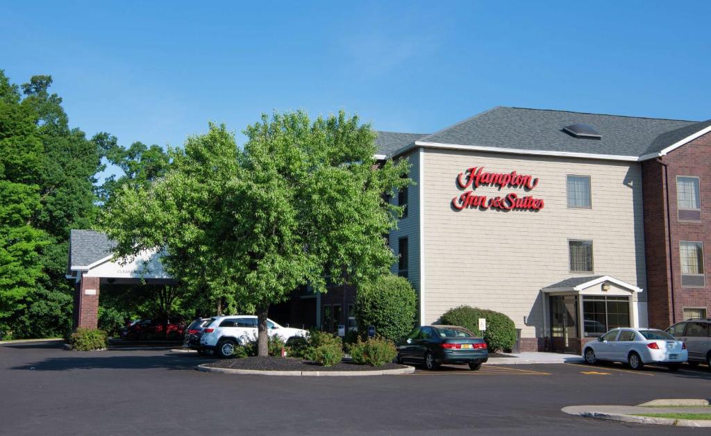 a building with a sign on the side of it at Hampton Inn & Suites Rochester/Victor in Victor