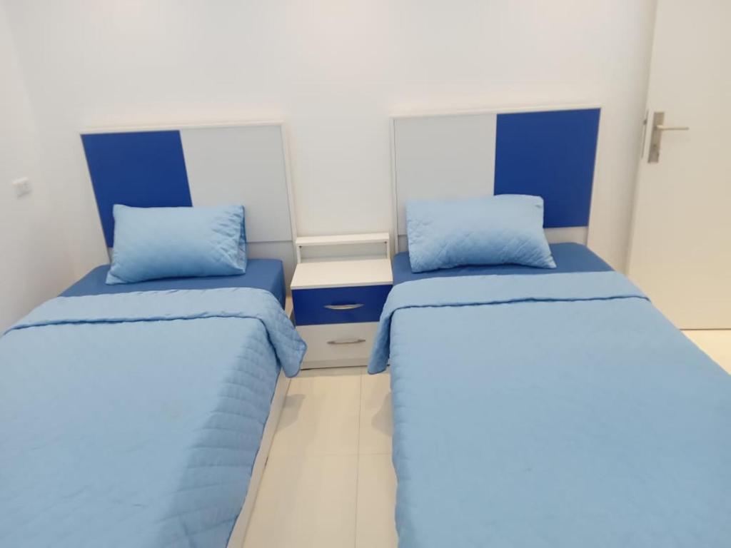 En eller flere senge i et værelse på كورنيش المعادي