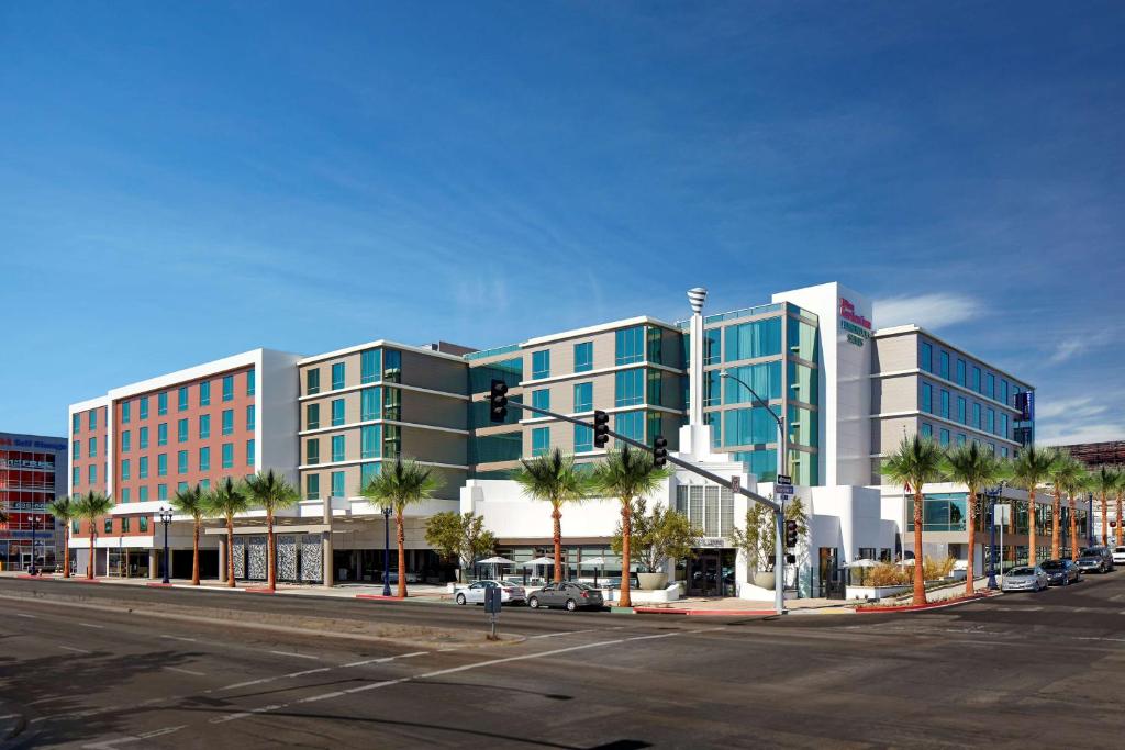 a large building on a city street with a traffic light at Hilton Garden Inn San Diego Downtown/Bayside, CA in San Diego