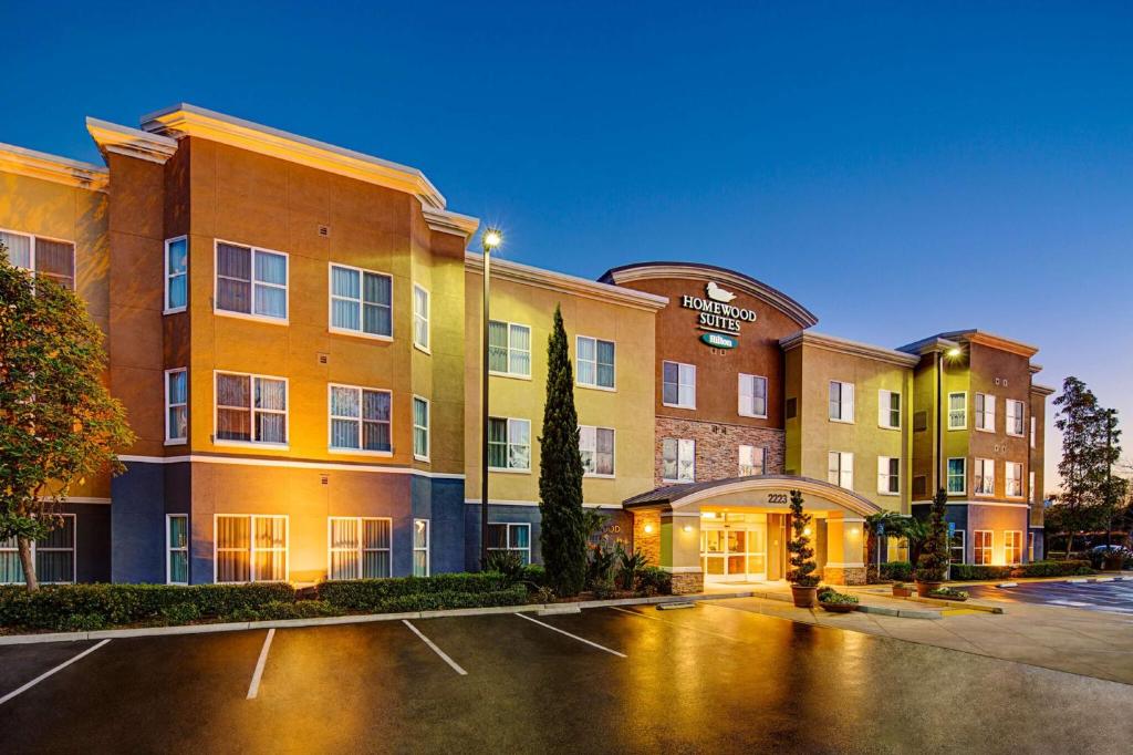 a hotel parking lot in front of a building at Homewood Suites by Hilton Carlsbad-North San Diego County in Carlsbad
