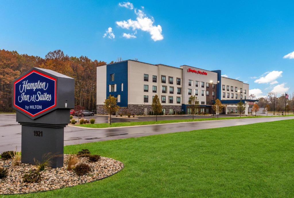 a sign in the grass in front of a building at Hampton Inn & Suites Benton Harbor, MI in Benton Harbor