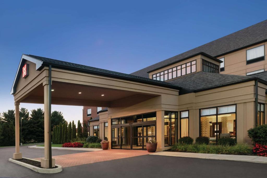 a large office building with a large garage at Hilton Garden Inn South Bend in South Bend